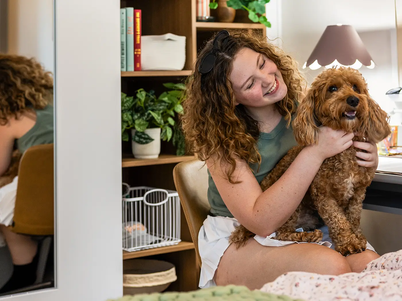 young woman cuddling a dog